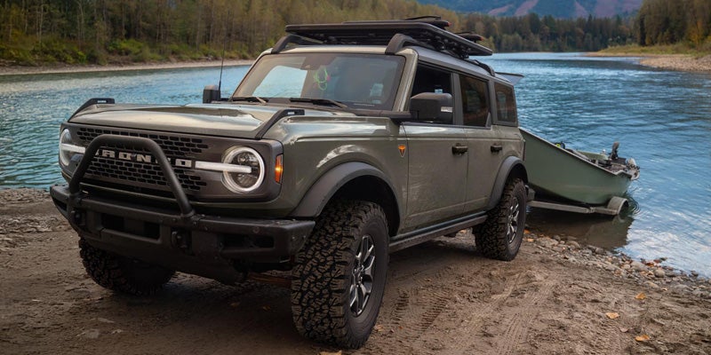 Gray Ford Bronco SUV near lake