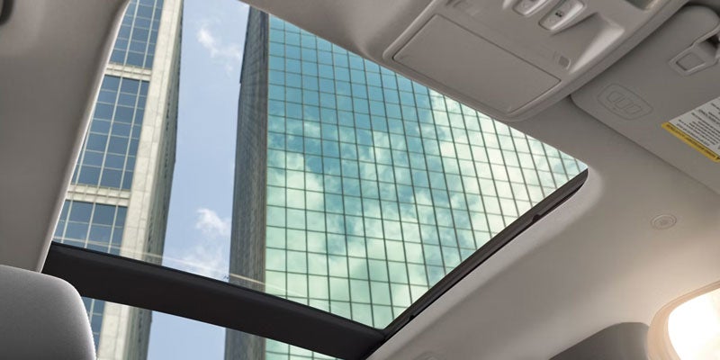 2026 Ford Escape panoramic sunroof in Benton AR with sun and moon visible, providing natural light and airy cabin feel