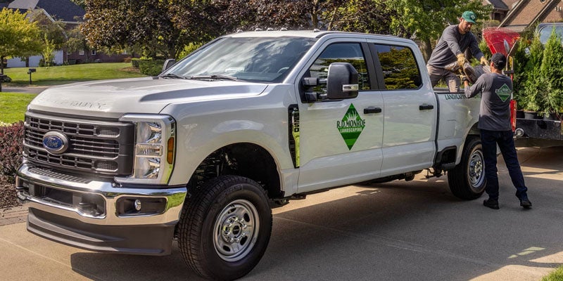 2026 Ford F-250 Super Duty business branded truck arriving at a residential job site in Benton, AR