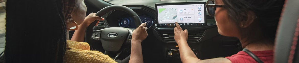 Driver using Ford SYNC touchscreen display